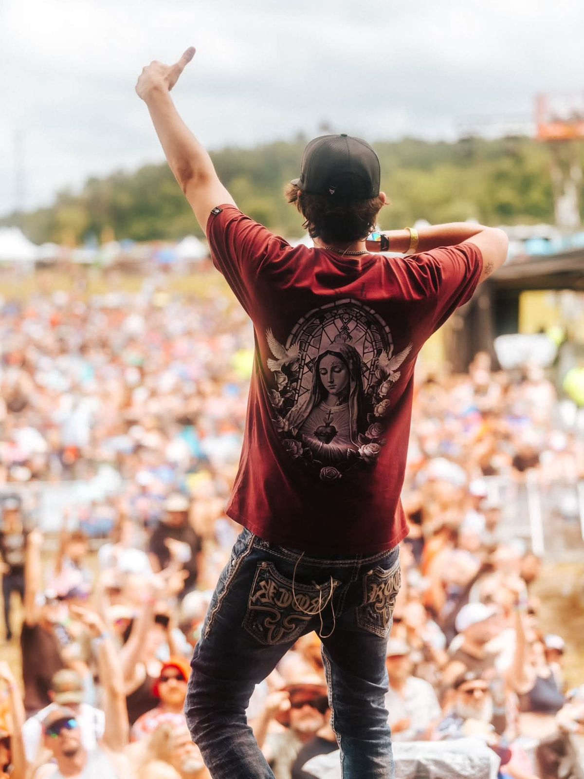 On stage in front of a festival crowd